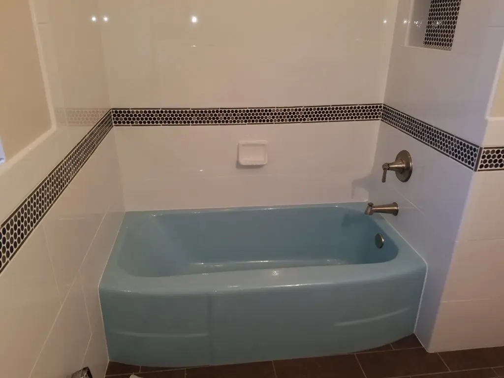 Worn porcelain tub before restoration