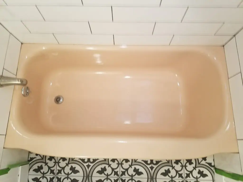 Bathtub before refinishing - stains and wear visible