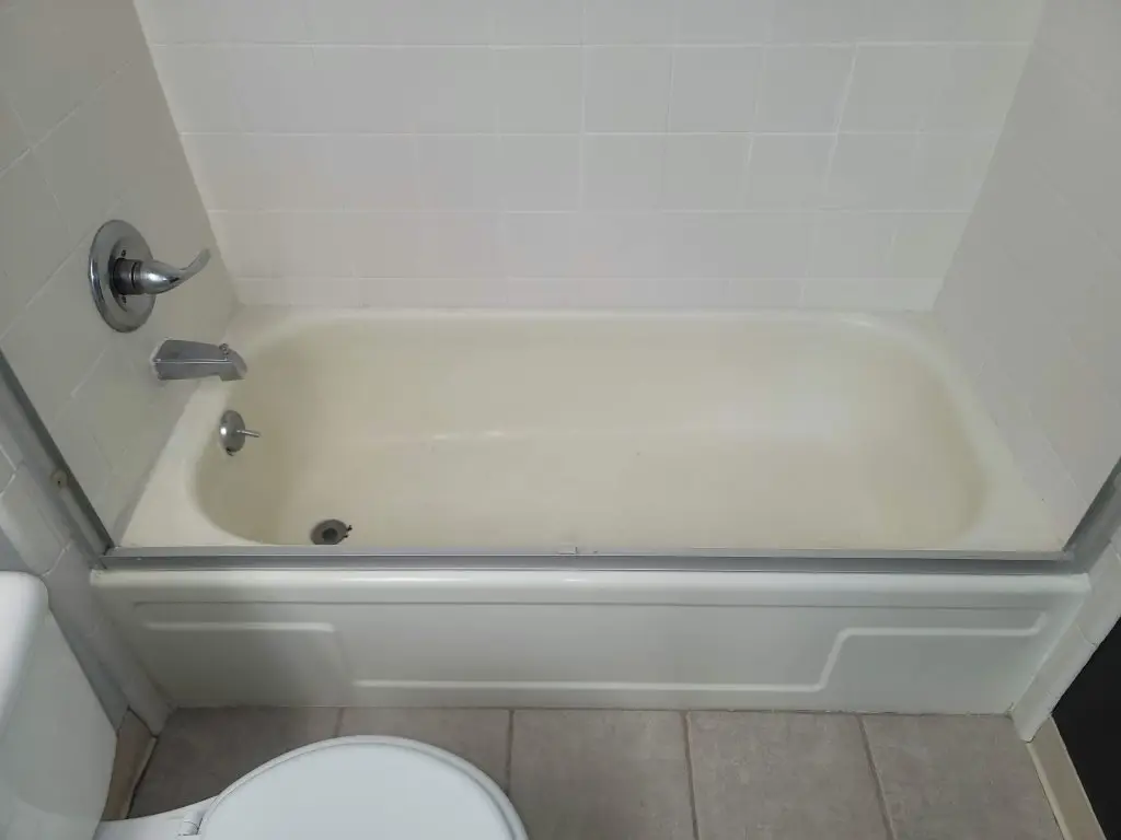 Stained fiberglass tub before professional resurfacing
